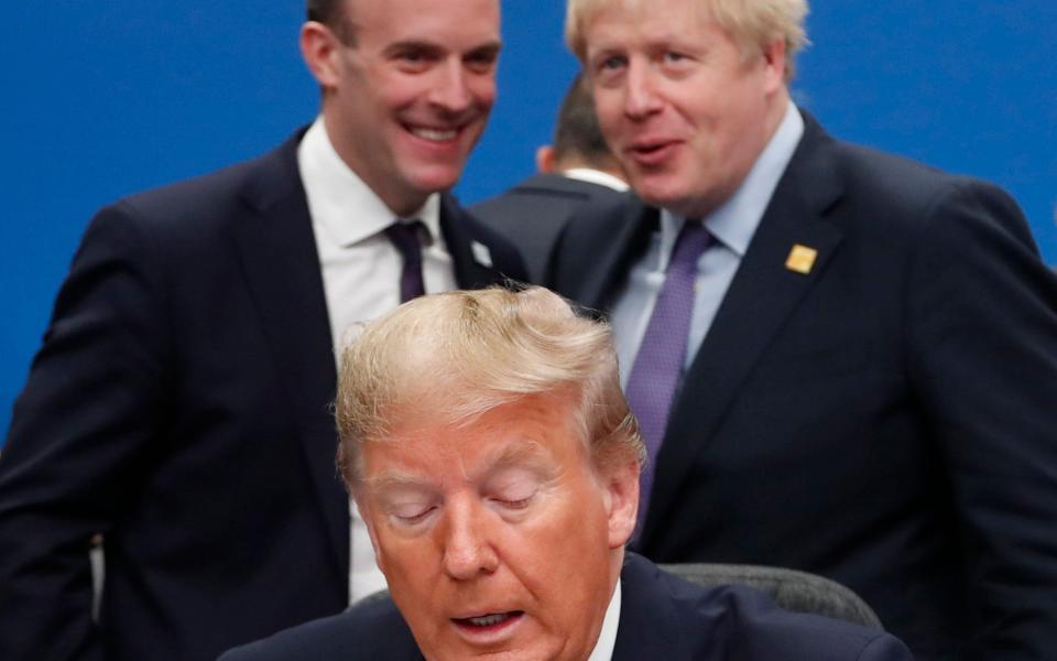 Dominic Raab (left) rejected suggestions the UK Government had got too 'cozy' with Donald Trump - AP