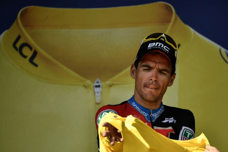 Greg Van Avermaet puts on the overall leader's yellow jersey again