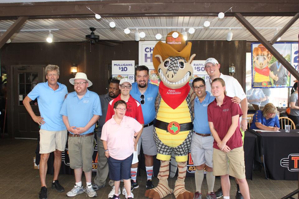 Texas Roadhouse Founder and CEO Kent Taylor, far left, poses with athletes from Special Olympic Kentucky during the 20th Annual Armadillo Classic in Louisville, Ky., in November.