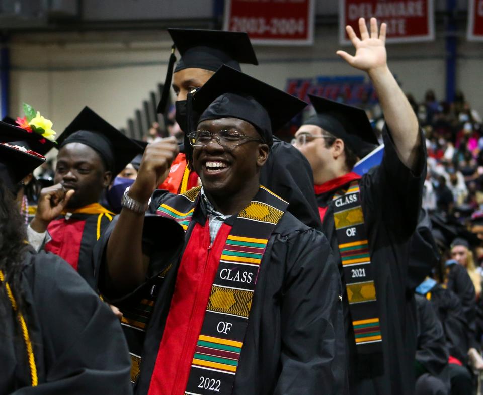 Terron Adlam of Wilmington reacts as his school is recognized during Delaware State University's 2022 commencement ceremonies in Memorial Hall, Saturday, May 14, 2022. Adlam received a degree in biological sciences.