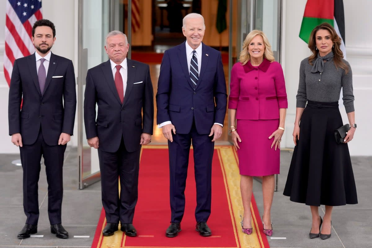 President Joe Biden, centre, and First Lady Jill Biden, second right, greet King Abdullah of Jordan, second left, Queen Rania, right, and Crown Prince Hussein, left, at the White House (AP)