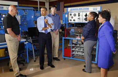 U.S. President Barack Obama (2nd L) tours the Community College of Allegheny West Hills Center with students in the Mechatronics program in Oakdale, Pennsylvania, April 16, 2014. REUTERS/Larry Downing