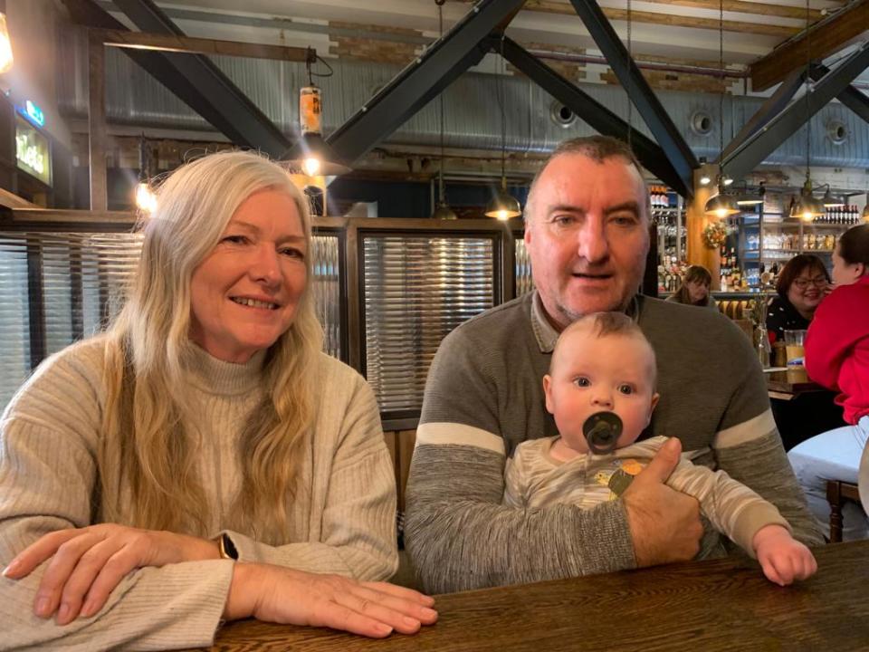 Mark Winter, with partner Lorraine and his two-year-old grandson. (Supplied)