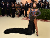 <p>Jennifer Lopez heated the red carpet up in this cut-out gown from Balmain with a massive cross as the main feature.Photo: Getty Images </p>
