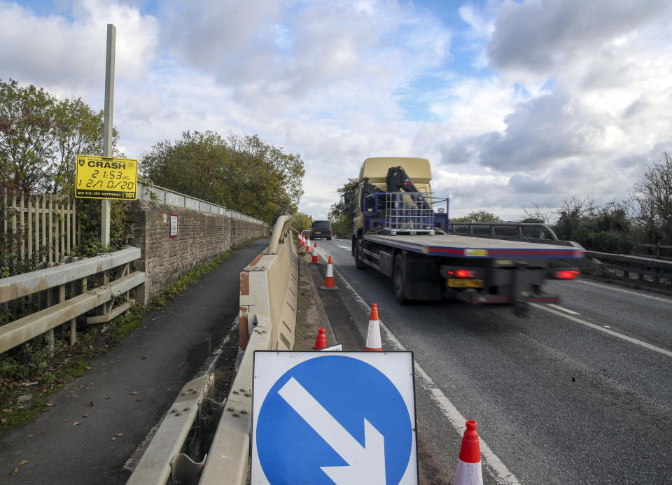 A police witness appeal sign on the A40 near Oxford where a four-year-old girl, a six-year-old boy, an eight-year-old girl and a 29-year-old woman from Chinnor, Oxfordshire, died Monday night after a collision between a people carrier and a heavy goods vehicle.