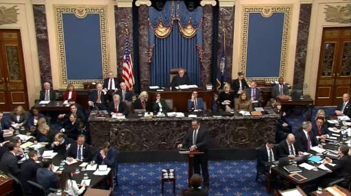 Deputy White House Counsel Mike Purpura (C, bottom), makes arguments for the defense in the Senate impeachment trial of President Donald Trump