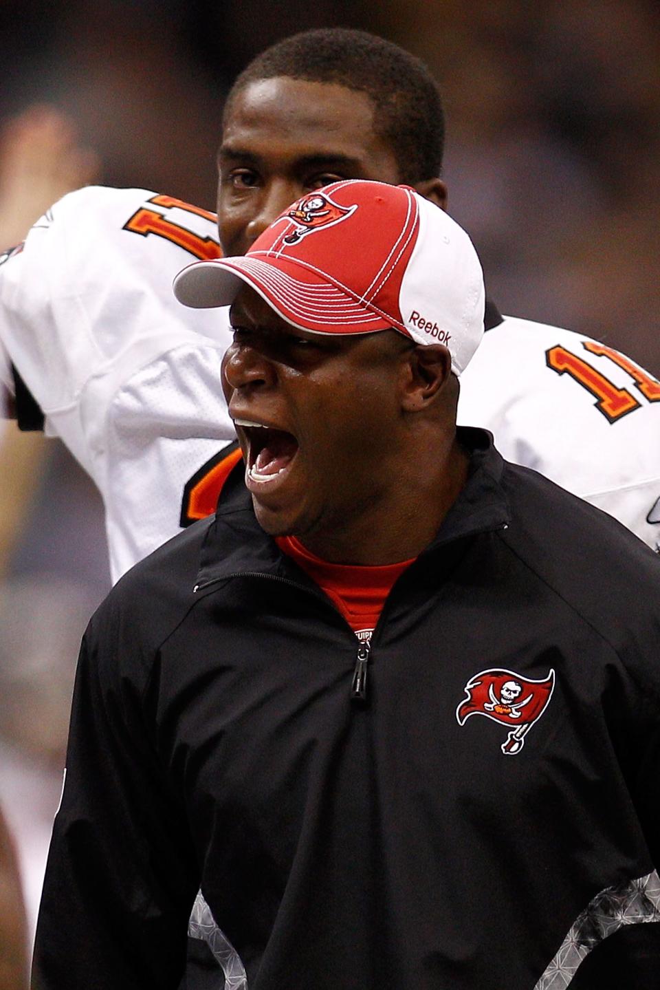 NEW ORLEANS, LA - JANUARY 02:  Head coach Raheem Morris of the Tampa Bay Buccaneers celebrates after a touchdown during the game against the New Orleans Saintsat the Louisiana Superdome on January 2, 2011 in New Orleans, Louisiana.  (Photo by Chris Graythen/Getty Images)
