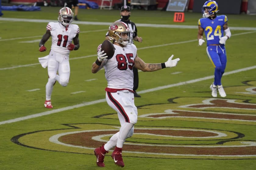 San Francisco 49ers tight end George Kittle (85) celebrates after scoring a touchdown.