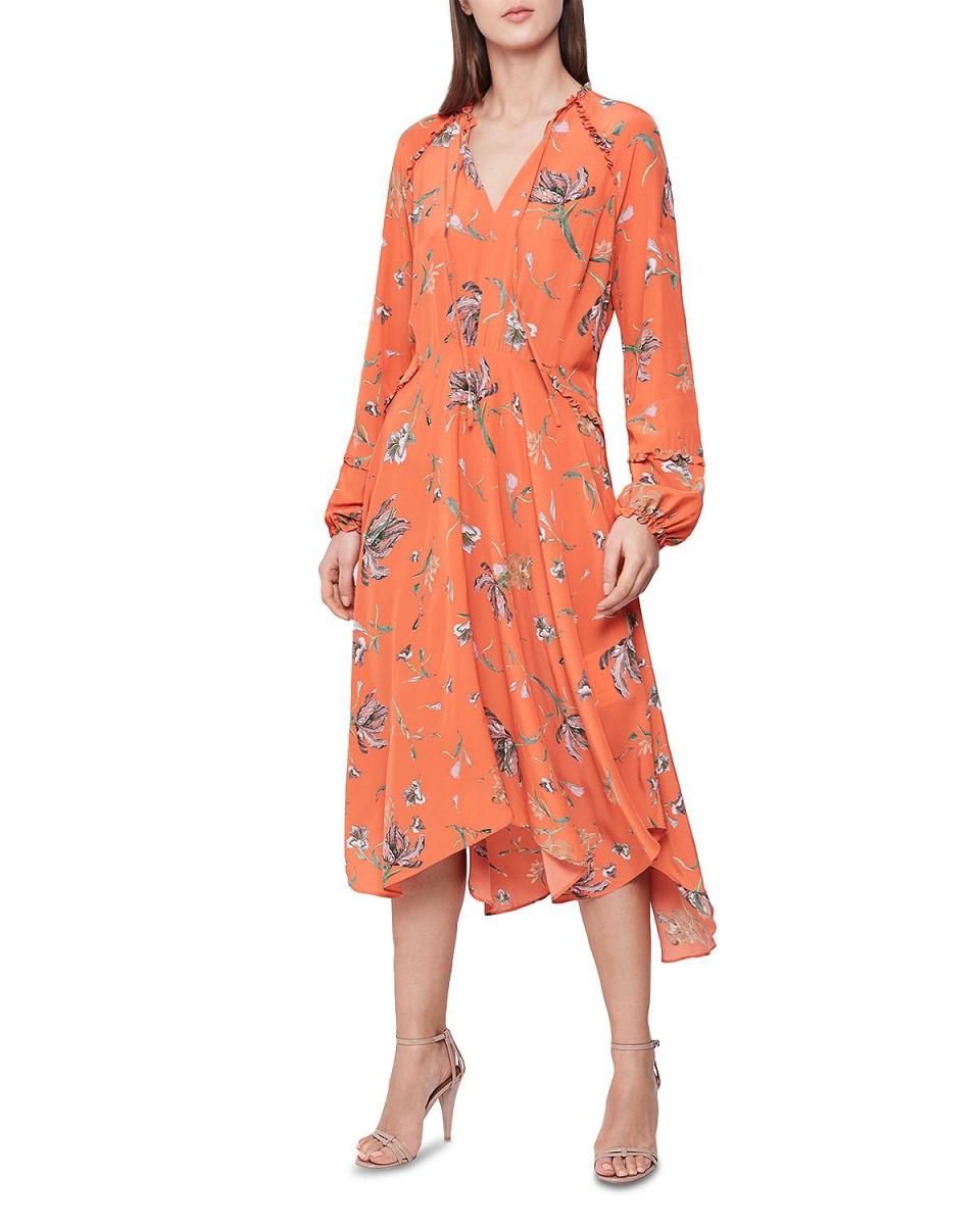 <b>Buy It! </b>Reiss Bay Floral Midi Dress, $425; <a href="https://click.linksynergy.com/deeplink?id=93xLBvPhAeE&mid=13867&murl=https%3A%2F%2Fwww.bloomingdales.com%2Fshop%2Fproduct%2Freiss-bay-floral-midi-dress%3FID%3D3269000&u1=PEO%2CShopping%3A15GorgeousWrapDressestoShopThisSummer%2CInspiredbyMeghanMarkleandMoreCelebs%2Crcarhart31%2CUnc%2CGal%2C7085788%2C201905%2CI" rel="nofollow noopener" target="_blank" data-ylk="slk:bloomingdales.com;elm:context_link;itc:0;sec:content-canvas" class="link ">bloomingdales.com</a>