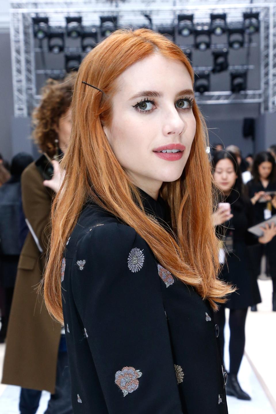 Just in time for the music festival, Emma Roberts debuts brunette hair and looks super chic and fashionable.