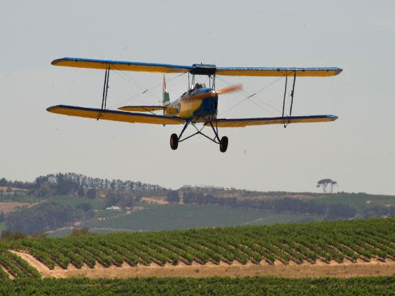 A De Havilland Tiger Moth aircraft - similar to the one that crashed in Kent - flying in South Africa (Getty STOCK)