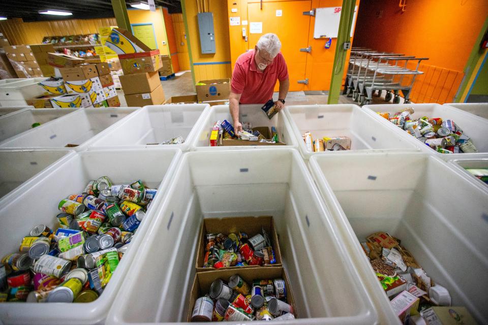 Fred Youngen picks up food for the pantry at First Brethren Church of South Bend on Wednesday, May 18, 2022, at the Food Bank of Northern Indiana in South Bend.