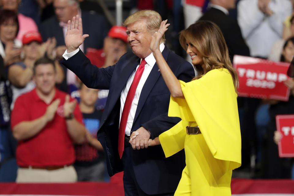 President Donald Trump and first lady Melania Trump greet supporters at a rally where the president formally announced his 2020 re-election bid Tuesday, June 18, 2019, in Orlando, Fla. (AP Photo/John Raoux)