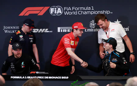 Formula One F1 - Monaco Grand Prix - Circuit de Monaco, Monte Carlo, Monaco - May 22, 2019 Ferrari's Charles Leclerc shakes hands with Williams' Robert Kubica during a press conference ahead of the Monaco Grand Prix REUTERS/Gonzalo Fuentes