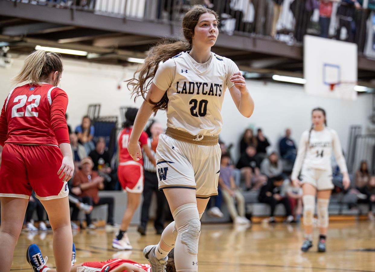 Whitefield Academy's Allison Spieker (20) walked towards the bench with intensity after scoring as the Whitefield Academy Lady Wildcats hosts the Christian Academy Lady Centurions on Thursday night. Whitefield went on to defeat CAL, 70-55. Dec. 14, 2023