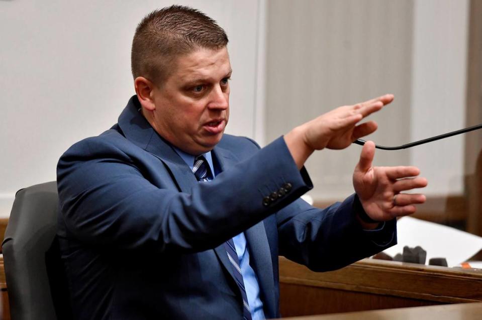 FILE - Eric DeValkenaere testifies during his trial on Nov. 10, 2021, at the Jackson County Courthouse in Kansas City.