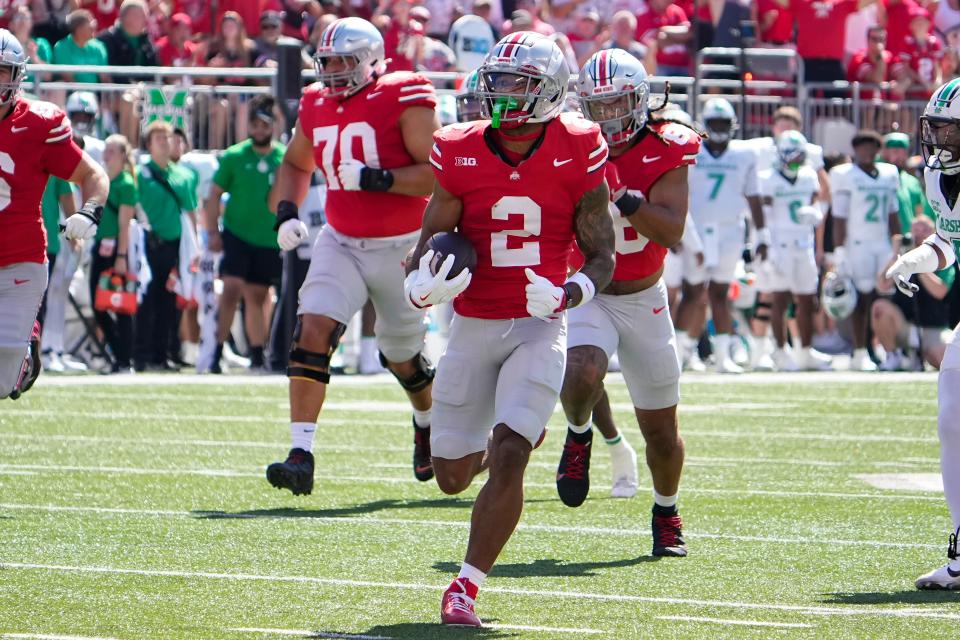 Ohio State receiver Emeka Egbuka runs for a touchdown against Marshall on Saturday.