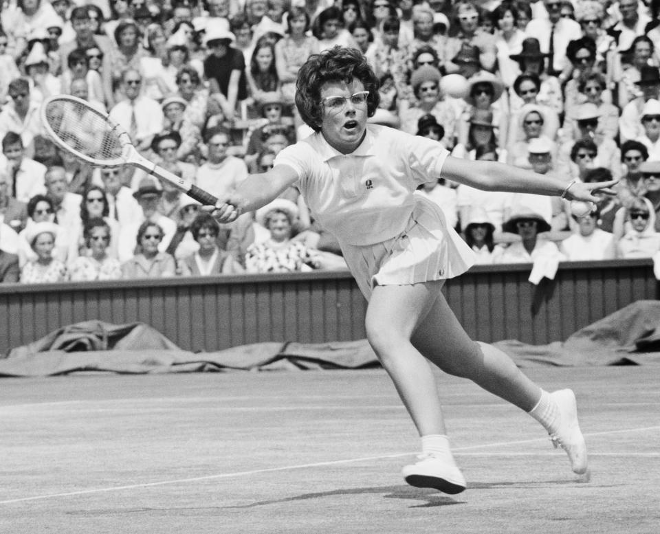 American tennis player Billie Jean King in action at Wimbledon in 1964. Over the course of her career, King won 39 Grand Slam titles. (Photo by Dennis Oulds/Central Press/Getty Images)