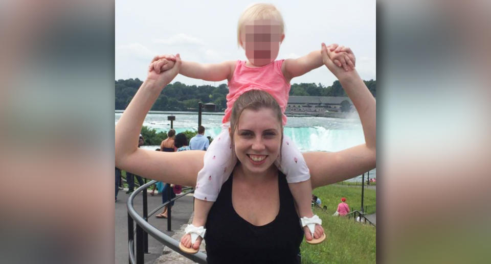 Kelly Wilkinson pictured with a child on her shoulders.