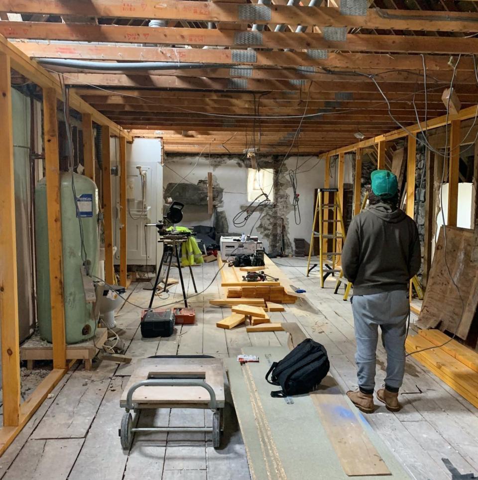 Simon Hunt is pictured from behind amid the internal renovation of Kilmartin Castle.