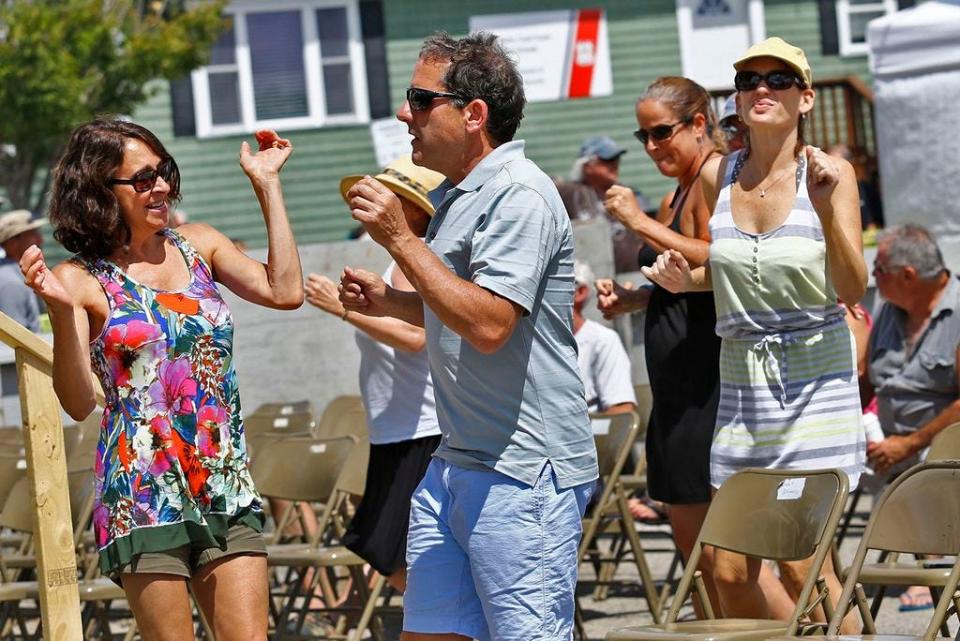 The band Entrain entertains fans at the Bandstand.

The annual Scituate Heritage Day in the harbor and Front Street on Sunday, August 7, 2016.
Greg Derr/ The Patriot Ledger.