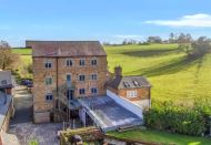 <p>On the hunt for a unique home? This five-bedroom property was once a former mill that has been updated in recent years. With five bedrooms, sprawling land and one acre gardens, it's a wonderful place for a family to move in right away. Tempted? It's still for sale...</p><p><a href="https://www.onthemarket.com/details/8472098/" rel="nofollow noopener" target="_blank" data-ylk="slk:This property is currently on the market for £500,000 via Town & Country at Onthemarket.com;elm:context_link;itc:0;sec:content-canvas" class="link ">This property is currently on the market for £500,000 via Town & Country at Onthemarket.com</a>. </p>