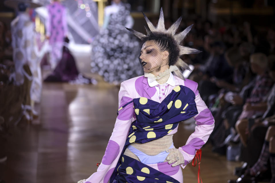 A model wears a creation for the Thom Browne ready-to-wear Spring/Summer 2023 fashion collection presented Monday, Oct. 3, 2022 in Paris. (Photo by Vianney Le Caer/Invision/AP)