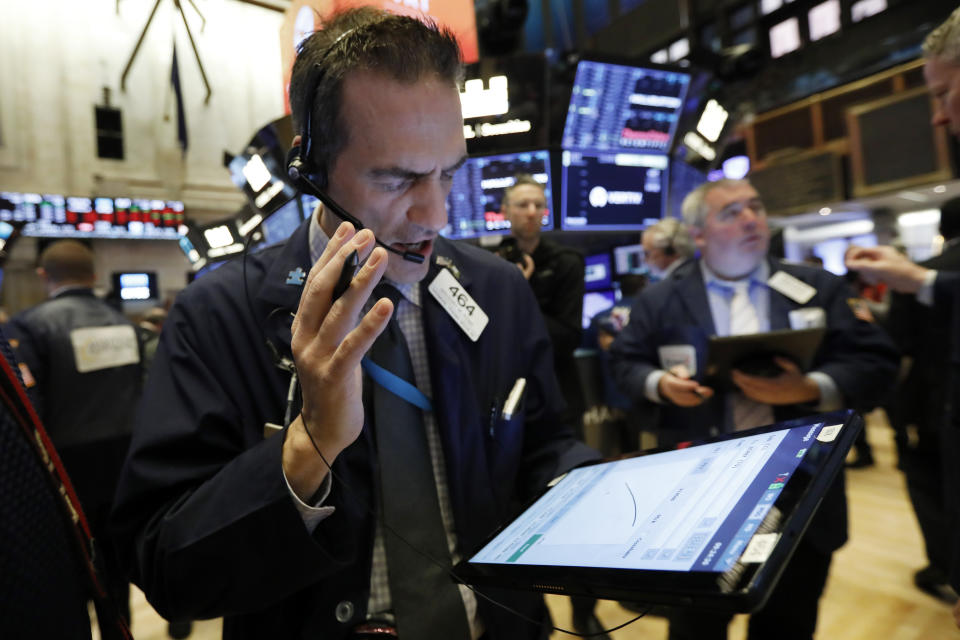 Trader Gregory Rowe works on the floor of the New York Stock Exchange, Friday, Feb. 28, 2020. Stocks are opening sharply lower on Wall Street, putting the market on track for its worst week since October 2008 during the global financial crisis. (AP Photo/Richard Drew)