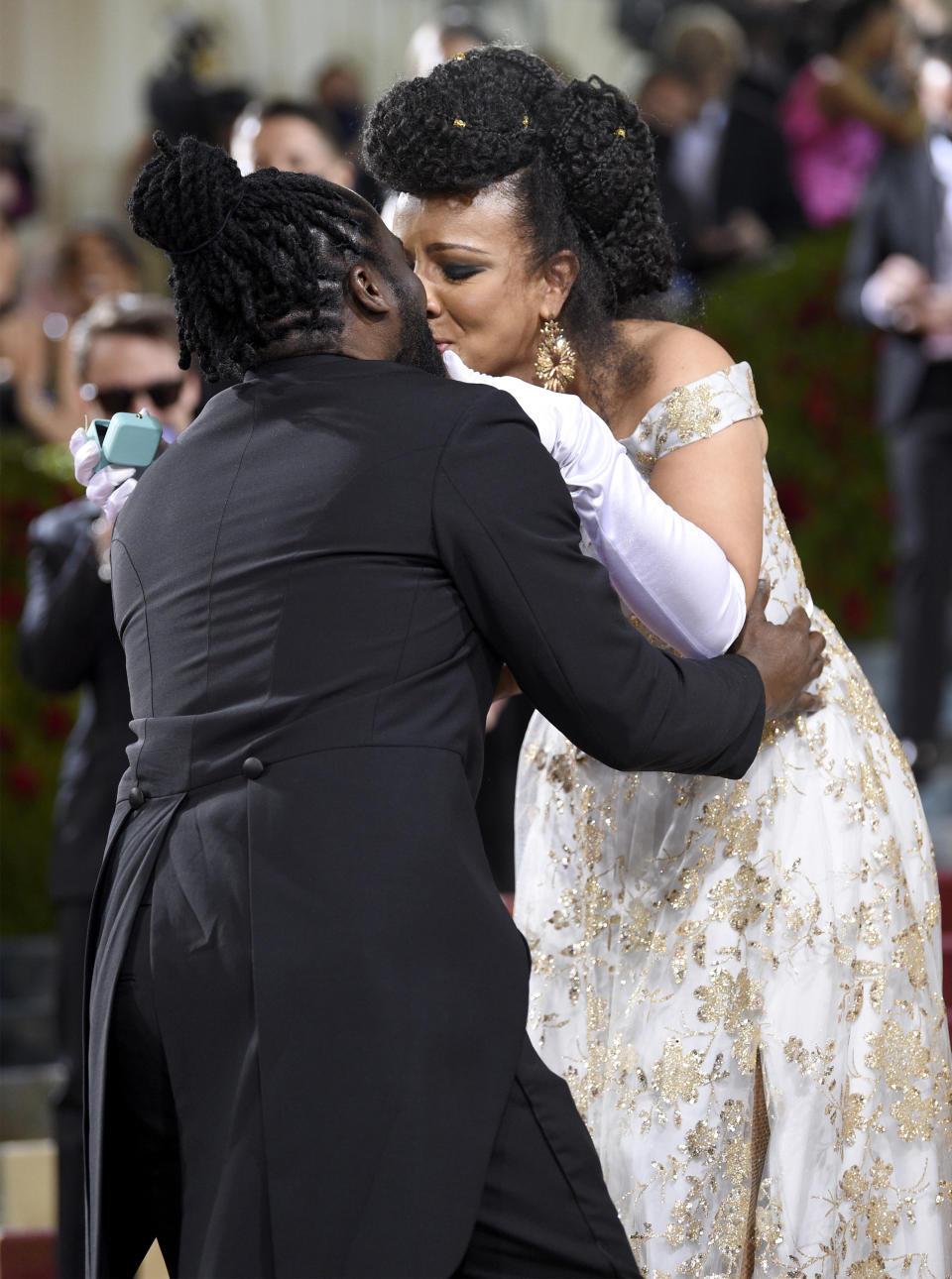 Former New York State Assembly candidate Bobby Digi Olisa, left, proposes to Laurie Cumbo, Commissioner of New York City Department of Cultural Affairs, at The Metropolitan Museum of Art's Costume Institute benefit gala celebrating the opening of the "In America: An Anthology of Fashion" exhibition on Monday, May 2, 2022, in New York. (Photo by Evan Agostini/Invision/AP)