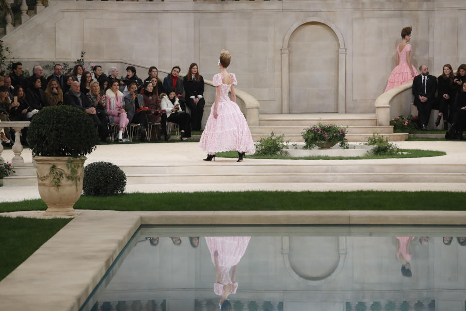 Models wear creations for the Chanel Spring/Summer 2019 Haute Couture fashion collection presented in Paris, Tuesday Jan. 22, 2019. (AP Photo/Christophe Ena)