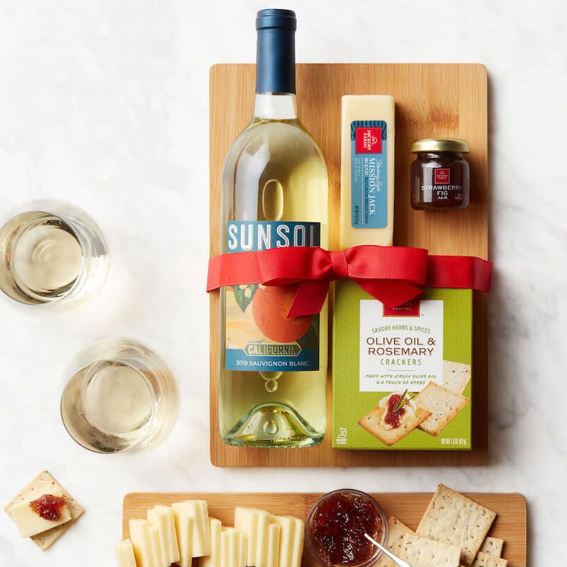 <p><a href="https://go.redirectingat.com?id=74968X1596630&url=https%3A%2F%2Fwww.hickoryfarms.com%2Fgift-baskets%2Fwine%2Fwhite-wine-and-cheese-board-gift-set-001239.html%3Fgridindex%3D18%26cgid%3Dwine-gifts%23start%3D1&sref=https%3A%2F%2Fwww.esquire.com%2Ffood-drink%2Fg38036473%2Fbest-wine-gift-baskets%2F" rel="nofollow noopener" target="_blank" data-ylk="slk:Shop Now;elm:context_link;itc:0;sec:content-canvas" class="link rapid-noclick-resp">Shop Now</a></p><p>White Wine & Cheese Board Gift Set</p><p>$39.99</p><p>hickoryfarms.com</p>