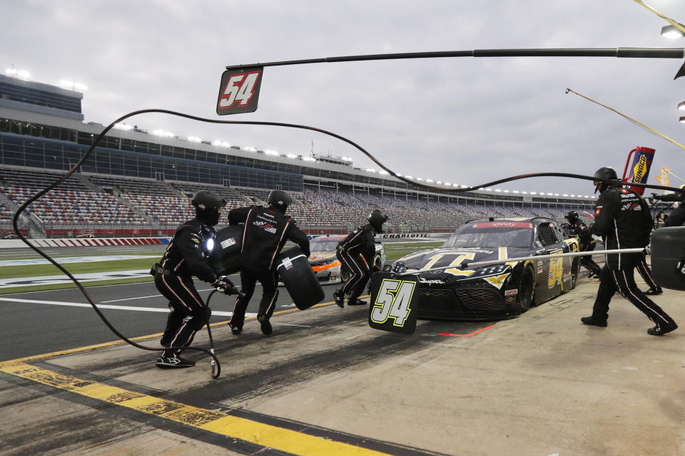 Kyle Busch makes a pit stop during a NASCAR Xfinity Series auto race at Charlotte Motor Speedway Monday, May 25, 2020, in Concord, N.C. (AP Photo/Gerry Broome)