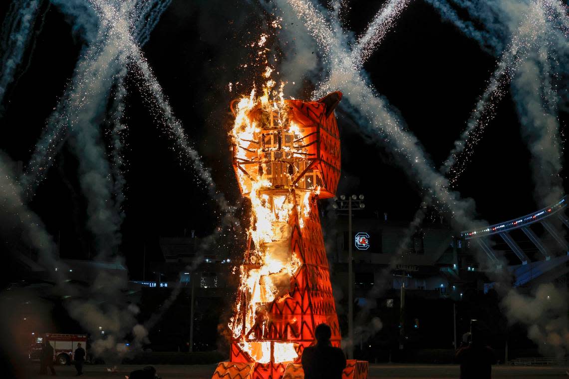 The 20-foot-tall Clemson Tiger goes up in flames during the annual Tiger Burn at the University of South Carolina intramural fields on Monday, Nov. 21, 2022, at Charleston Southern University. Students from the American Society of Mechanical Engineers constructed the tiger effigy. Tracy Glantz/tglantz@thestate.com