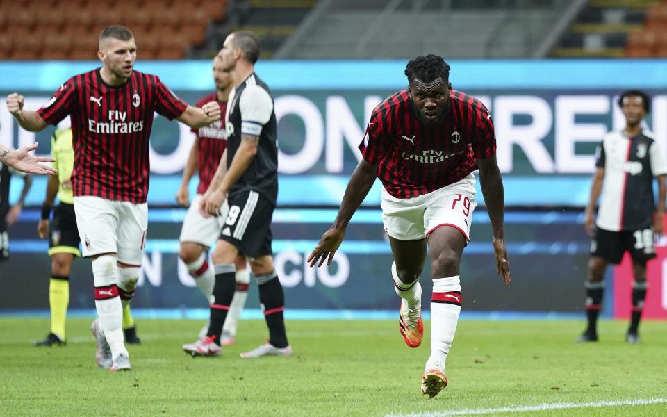 AC Milan's Franck Kessie celebrates after scoring his side's 2nd goal during the Serie A soccer match between AC Milan and Juventus at the Milan San Siro Stadium, Italy, Tuesday, July 7, 2020. (Spada/LaPresse via AP)