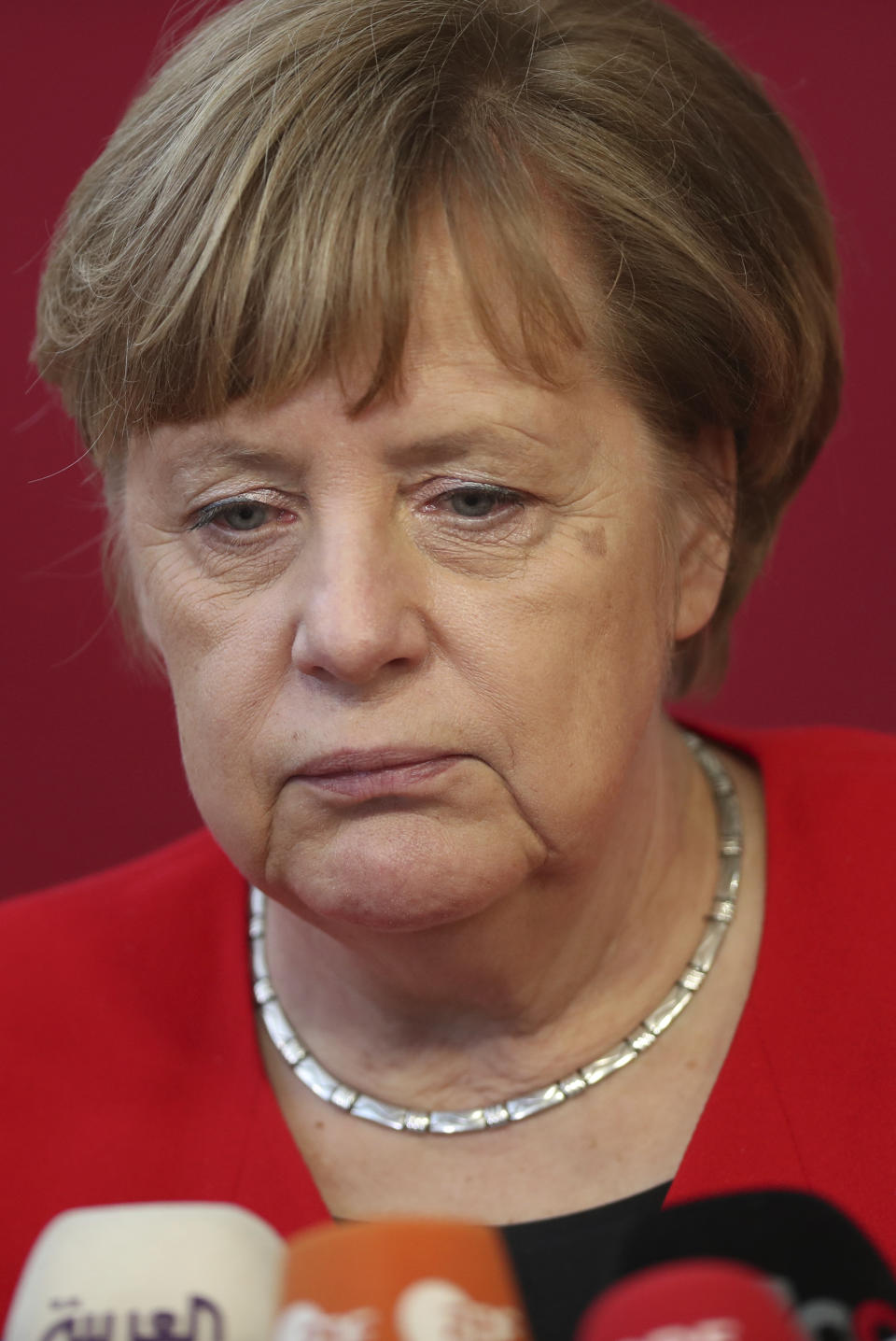 German Chancellor Angela Merkel speaks with the media as she arrives for an EU summit in Brussels, Thursday, March 21, 2019. British Prime Minister Theresa May is trying to persuade European Union leaders to delay Brexit by up to three months, just eight days before Britain is scheduled to leave the bloc. (AP Photo/Francisco Seco)