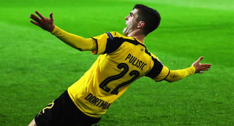 Christian Pulisic celebrates after scoring a goal for Borussia Dortmund during a Champions League Round of 16 game. (Getty)