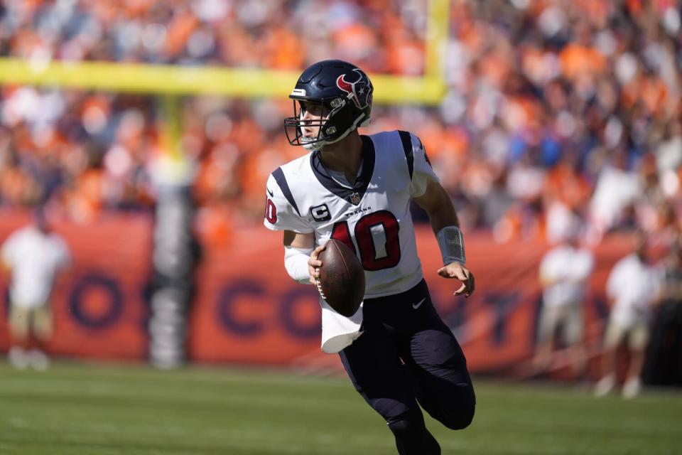 Houston Texans quarterback Davis Mills looks to pass.