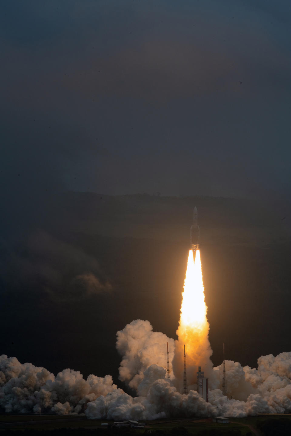 Arianespace's Ariane 5 rocket with NASA's James Webb Space Telescope onboard, lifts off Saturday, Dec. 25, 2021, at Europe's Spaceport, the Guiana Space Center in Kourou, French Guiana. The world's largest and most powerful space telescope has blasted off on a high-stakes quest to behold light from the first stars and galaxies. NASA's James Webb Space Telescope rocketed away Saturday from French Guiana in South America. (ESA-Stephane Corvaja via AP)