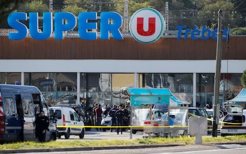 gendarmes and police officers at a supermarket after a hostage situation in Trebes - Credit: REGIS DUVIGNAU /Reuters