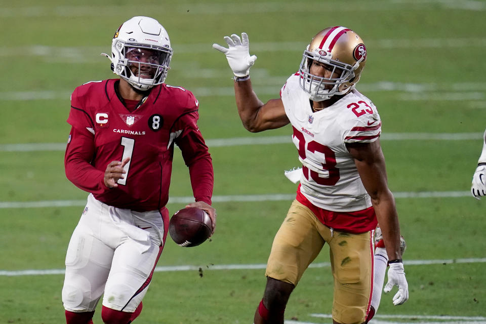 Arizona Cardinals quarterback Kyler Murray (1) runs as San Francisco 49ers cornerback Ahkello Witherspoon (23) defends during the second half of an NFL football game, Saturday, Dec. 26, 2020, in Glendale, Ariz. (AP Photo/Ross D. Franklin)