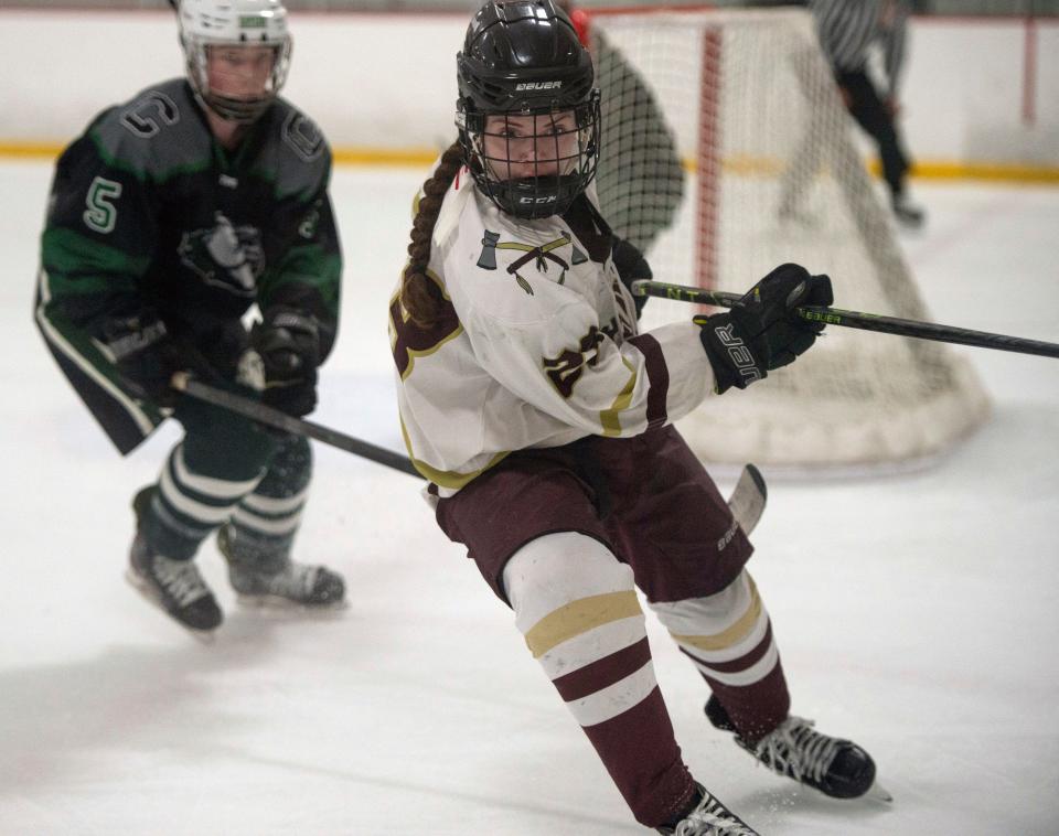 Algonquin junior assistant captain Emily Johns (Clinton) goes after a puck in the corner, during the game against Canton at the New England Sports Center in Marlborough ON Feb. 20. The Titans were defeated by the Bulldogs, 2-1.