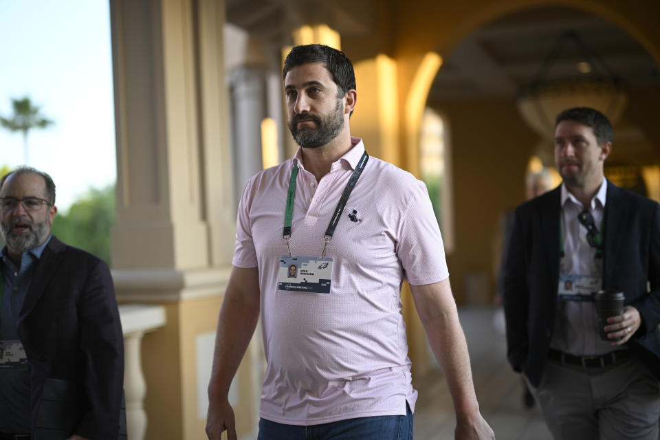 Philadelphia Eagles head coach Nick Sirianni, center, walks to an NFC coaches availability at the NFL football owners meetings, Tuesday, March 26, 2024, in Orlando, Fla. (AP Photo/Phelan M. Ebenhack)