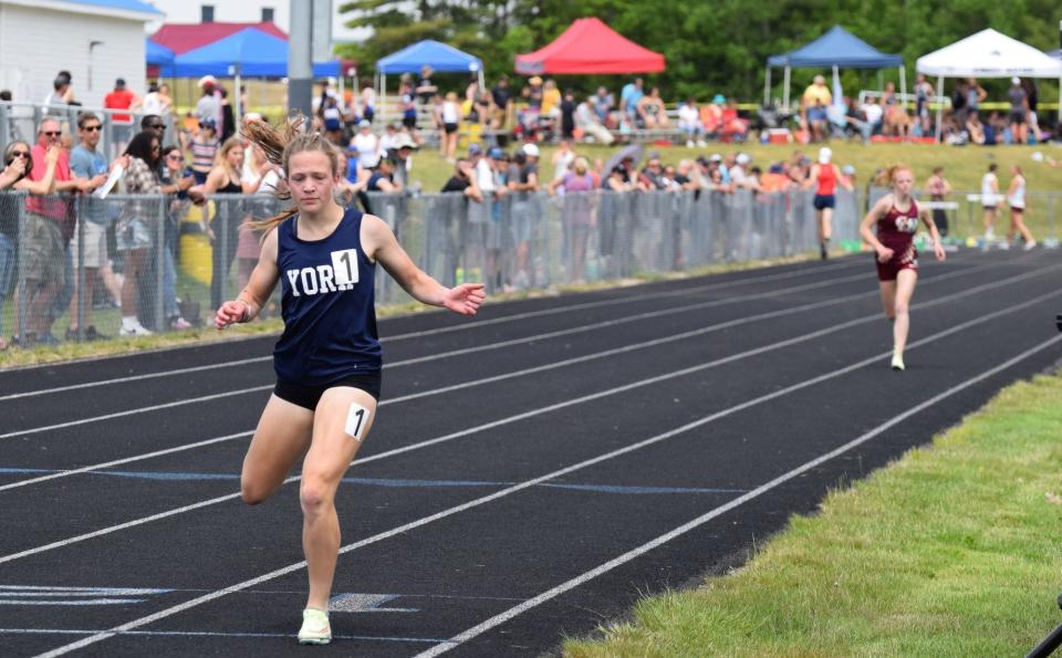 York sophomore Cary Drake crosses the finish line in first in the 1,600-meter run Saturday in Naples, Maine, during the Western Maine Conference Championships.