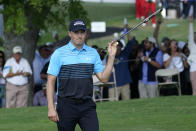 Jordan Spieth reacts after making an eagle putt on the 18th green during the first round of the AT&T Byron Nelson golf tournament, Thursday, May 13, 2021, in McKinney, Texas. (AP Photo/Tony Gutierrez)