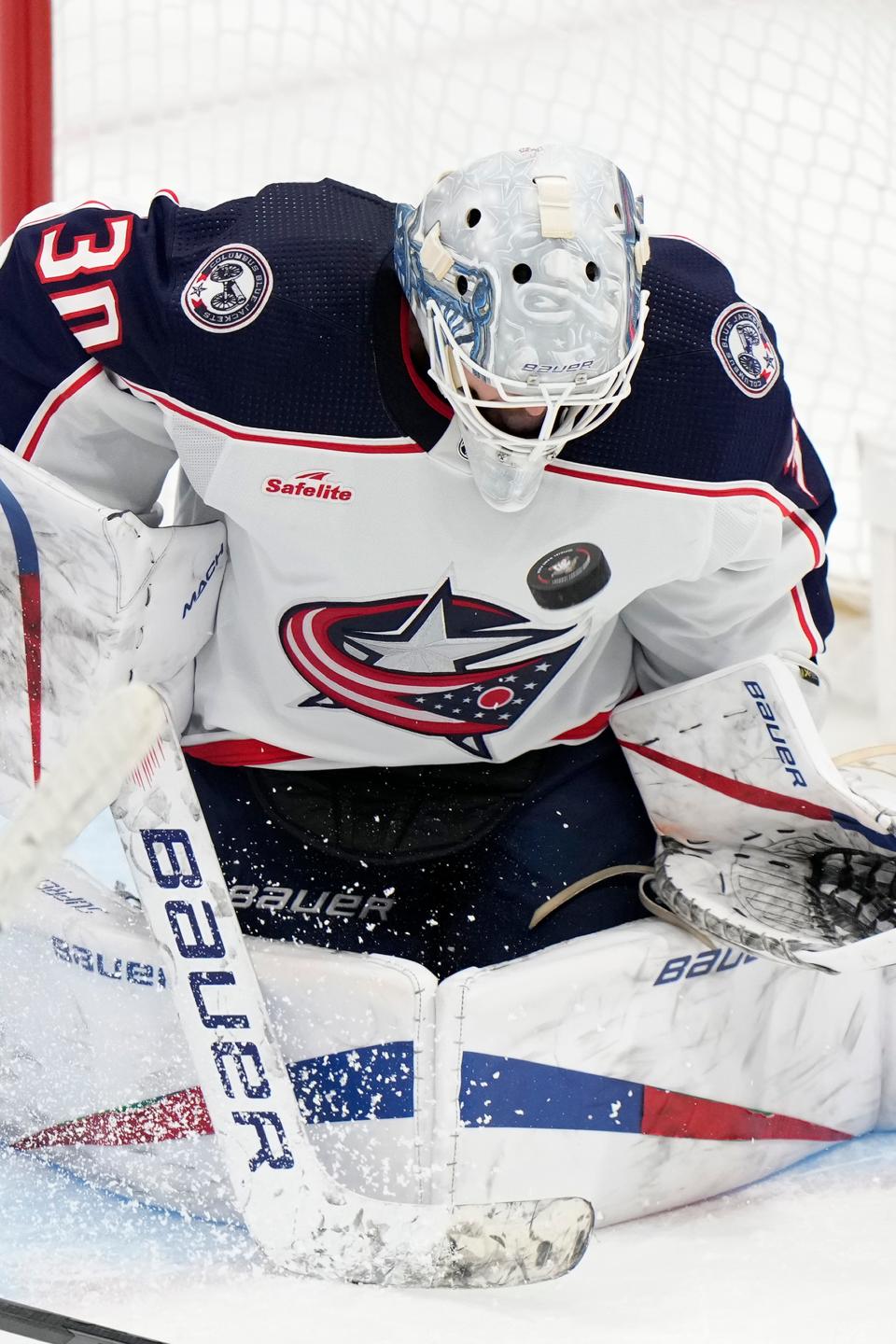Columbus Blue Jackets goaltender Spencer Martin (30) makes a save during the second period of an NHL hockey game against the Florida Panthers, Monday, Nov. 6, 2023, in Sunrise, Fla. (AP Photo/Wilfredo Lee)