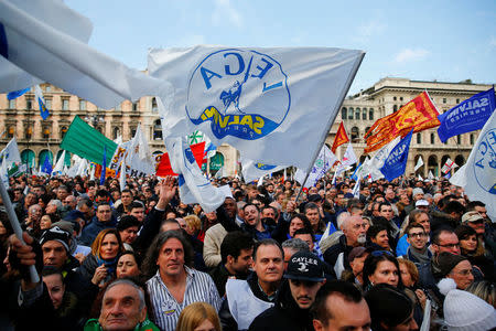 Italian Northern League supporters attend a political rally led by leader Matteo Salvini in Milan, Italy February 24, 2018. REUTERS/Tony Gentile