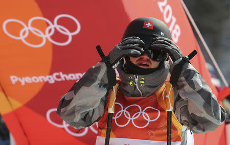 Freestyle Skiing - Pyeongchang 2018 Winter Olympics - Men's Ski Slopestyle Qualifications - Phoenix Snow Park - Pyeongchang, South Korea - February 18, 2018 - Fabian Boesch of Switzerland reacts after run. REUTERS/Mike Blake