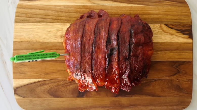 cooked meatloaf on board