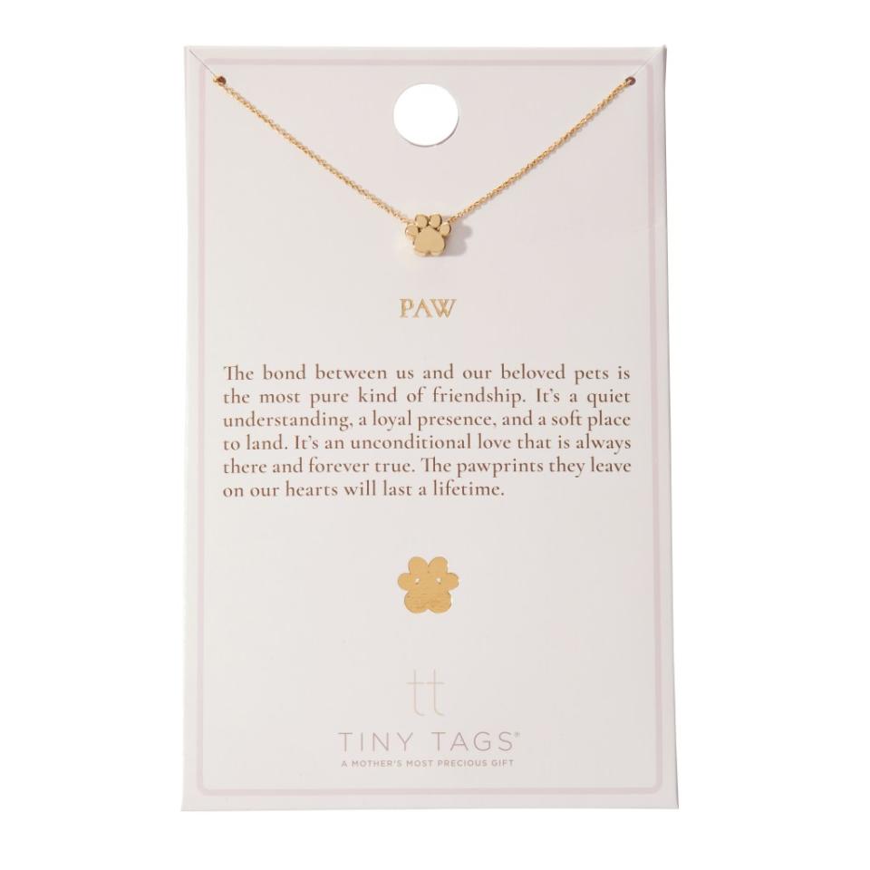 A gold plated cat paw necklace from Tiny Tags.