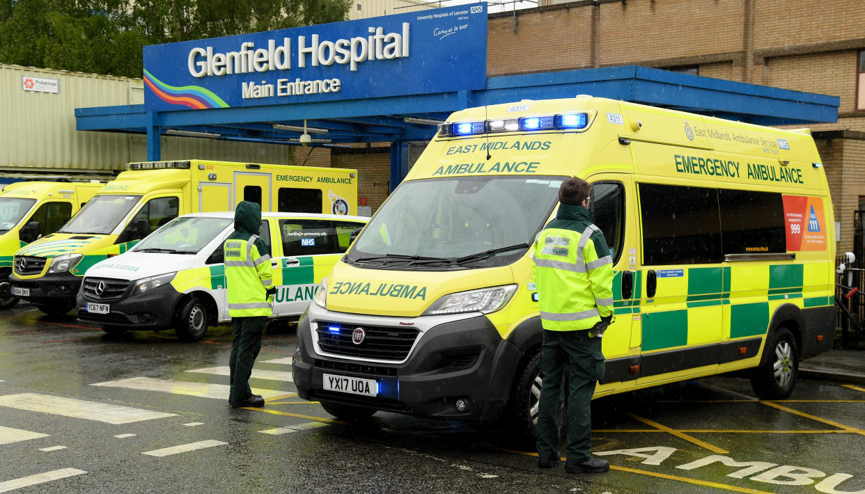 LEICESTER, UNITED KINGDOM - APRIL 28:NHS workers are seen during a minute's silence held in memory of NHS workers outside Glenfield Hospital on April 28, 2020 in Leicester, United Kingdom. The moment of silence, commemorating the key workers who have died during the Covid-19 pandemic, was timed to coincide with International Workers' Memorial Day. At least 90 NHS workers are reported to have died in the last month, in addition to transport employees and other key workers. (Photo by Ross Kinnaird/Getty Images)